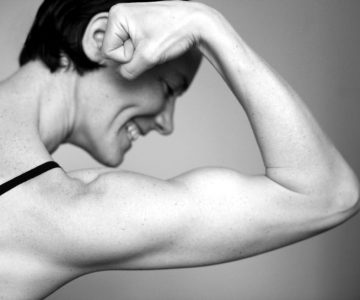 Muskelkraft als Sinnbild für Heizlast oder Heizleistung