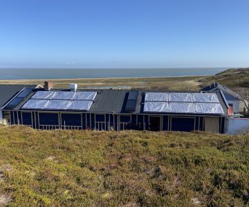 Kirche und Solarthermie Strandläufernest Sylt Paradigma
